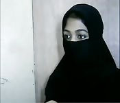 Hottie in a hijab shows sneak peeks of her hot pussy