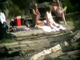 Wife having fun with strangers at beach. Public nudity