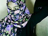 Hijab wearing girl fingers pussy