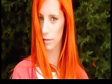 Orange haired beauty rubs herself