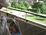 young blonde sucking on the veranda