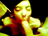 Petite asian sucks and slaps huge cock against her face.