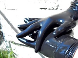 Two pairs Black latex exam gloves layered and shiny fetish