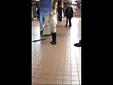 Naked woman in public dancing to subway band