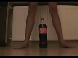 Tiny teen tries to ride a coke bottle