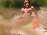 Babe masturbates spying on beach 