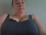 Busty teacher shows off her big tits and hourglass body