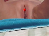 Pierced clit on the beach