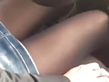 Italian woman in car wearing sexy stockings and boots