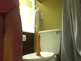 She is fucking the toilet.