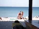 Threesome on public beach