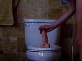 Soccer Mom with big boobs ride a Dildo on Toilet