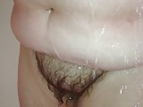 washing her sofy chubby hairy pussy in the shower.