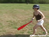 Cute teen Kitty playing baseball outdoors