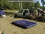 Lewd couple of naked students fucking in the tent