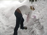 blonde plays in the snow