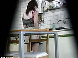 Caught woman masturbates in kitchen