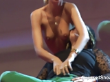 Hot blonde playing with her female fan on the stage