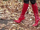 hot girl walking in leatherfetish panty, corset & red boots 