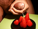 Putting cream on strawberries cumshot