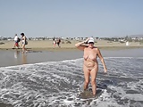 Adult woman shows her charms in the dunes