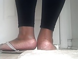 Thick ebony feet in flip flops