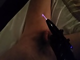 Violet wand on cock and balls.