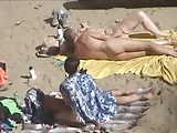 2 couples having fun next to each over on beach