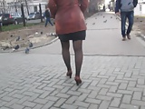 Girl flashing stockings walking on a street