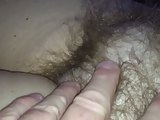 revealing & rubbing her soft hairy bush.