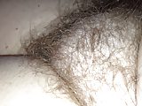 checking out her hairy pussy as she is half awake