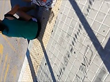 cum behind teens in bus stop