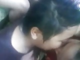 malay- lesbian couple smooching in front of friends