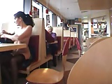 Busty babe flashing in a restaurant