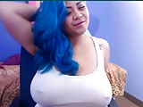 Blue haired girl shows her boobs