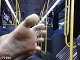 Candid feet and soles on the bus