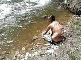 taking a bath at the river