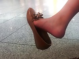 Candid asian girl dangle at the airport