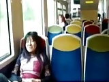 Asian milf rubs her clit on a train.