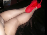 Red high heels and black pantyhose tights