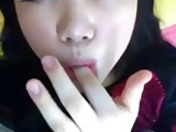 Amateur asian girl tasting herself