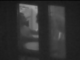 Couple caught through a window on spy cam