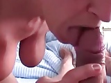 MILF with big tits gives a serious BJ, gets a nice facial.