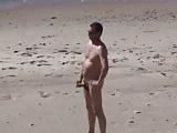 A Voyeur films a couple on beach