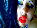 Kissing the cup wearing sexy red lipstick