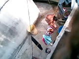 Desi aunty bathing caught by neighbour