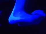 White stockings foot job under the black light