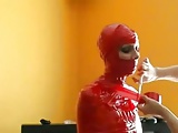 Mummified Bondage Babe In Red Tape