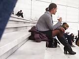 Sexy woman in black pantyhose sit on stairs