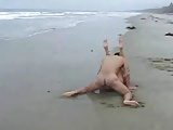 Brunette fucking on the beach